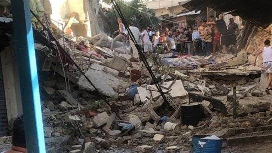 بالصور .. انهيار مبنى طرابلس